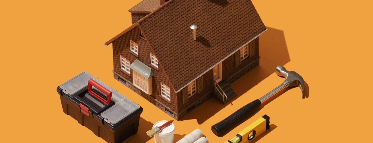 Home renovation, DIY and house improvement: model house with isometric tools